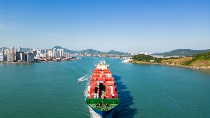 Ship with containers leaving port.