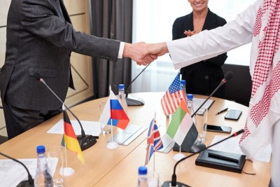 International delegates are shaking hands after a meeting.